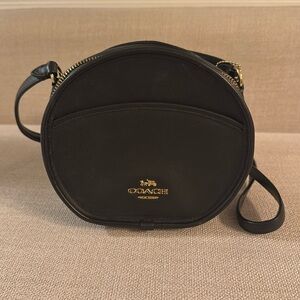 Coach black round crossbody bag